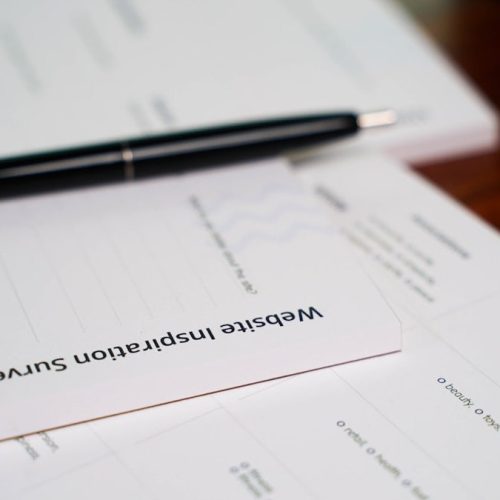 a pen sitting on top of a piece of paper
