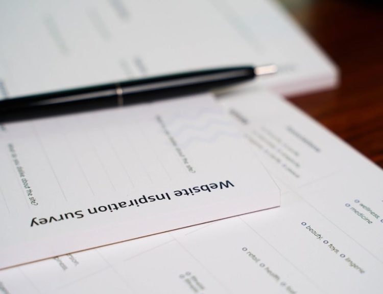 a pen sitting on top of a piece of paper